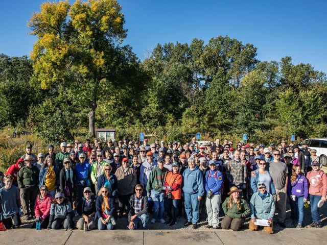 an extra large group of volunteers poses for a group picture at a national public lands day event