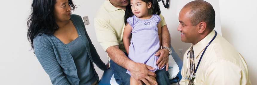 Doctor with family and little girl