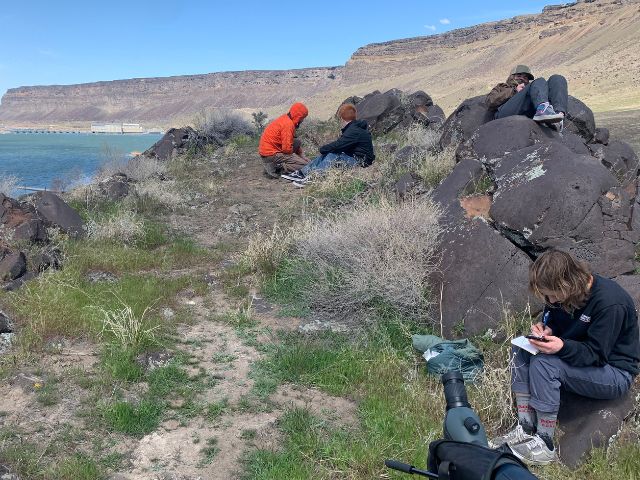 Students journaling just above Swan Falls Dam in Snake River Canyon.