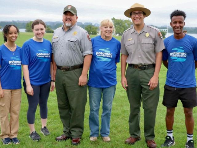 NPS director Chuck Sams stands with volunteers at Gravely Point during National Public Lands Day