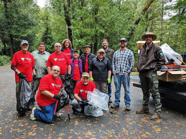 NPLD volunteers pose for a group photo after a trash clean up at BLM site Tyee Landing