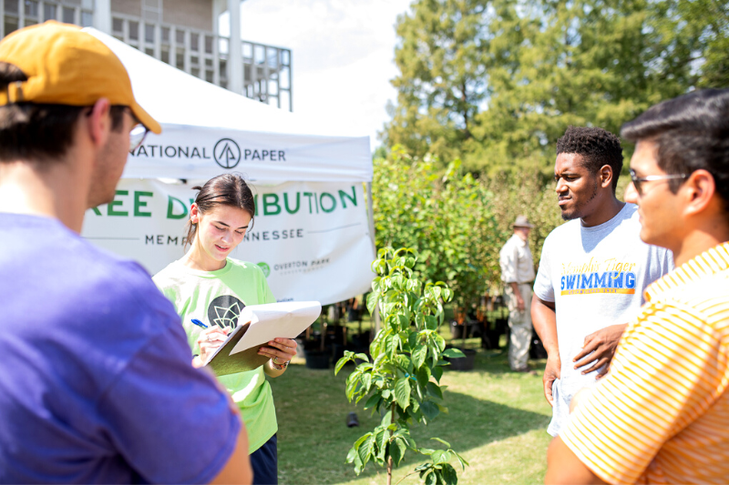 Volunteers at tree give away in Overton Park TN