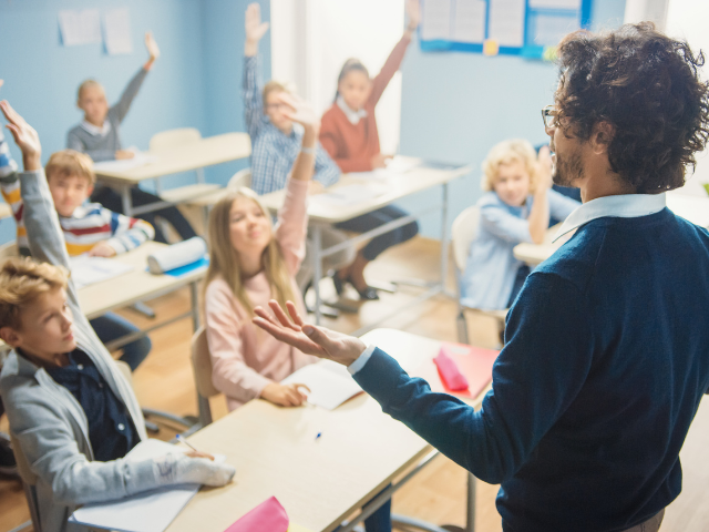 Teacher in front of classroom of students