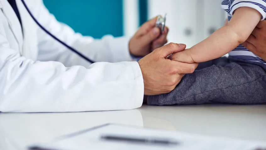 Doctor discussing lead poisoning with a child