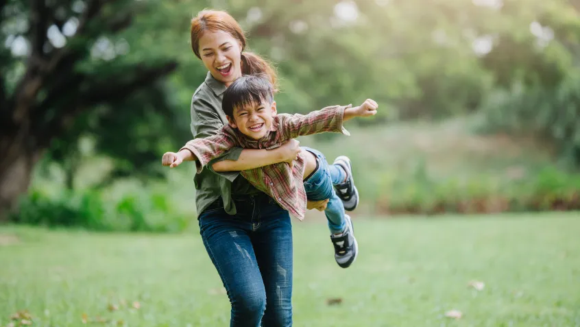 Parent and child playing outside