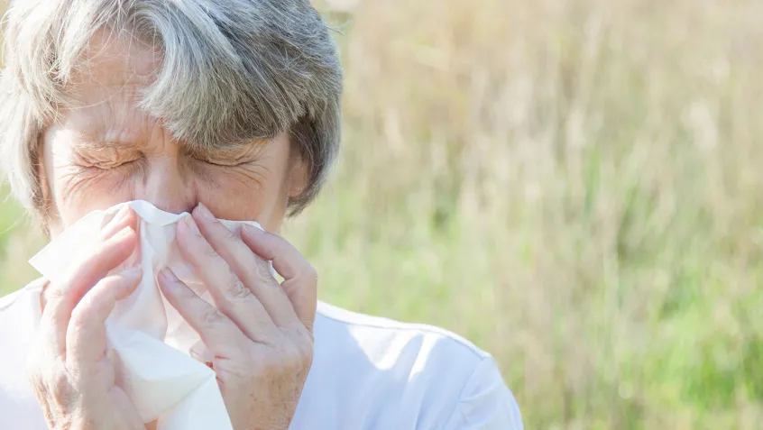 Mature woman using tissue