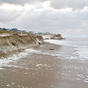  coastal beach erosion with the ocean taking away sand