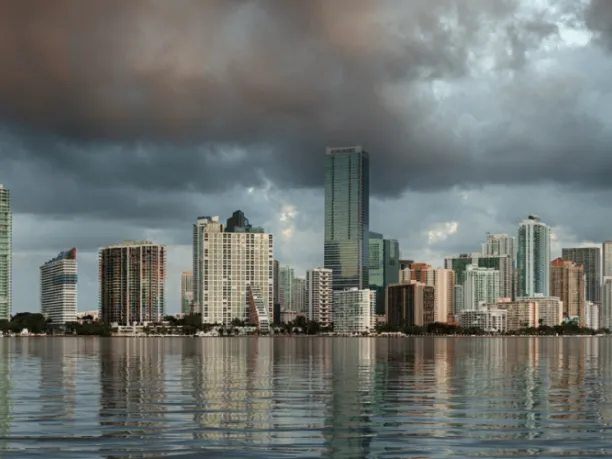 Dawn view of Miami Skyline reflected in water