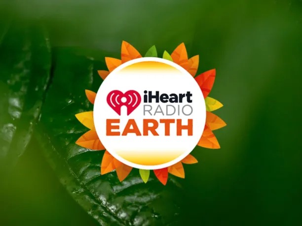 iHeart Radio Earth Logo with leaves in the background
