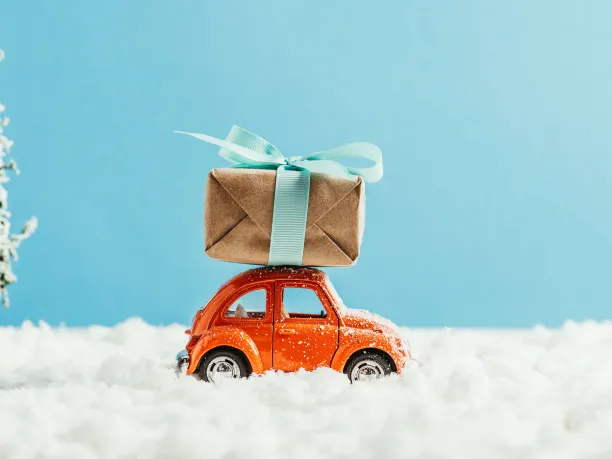 Toy car driving with a gift