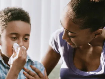 mother caring for son with stuffy nose