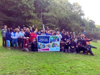 a group of volunteers poses for a photo after a successful national public lands day event