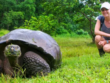 Woman posing with a turtle